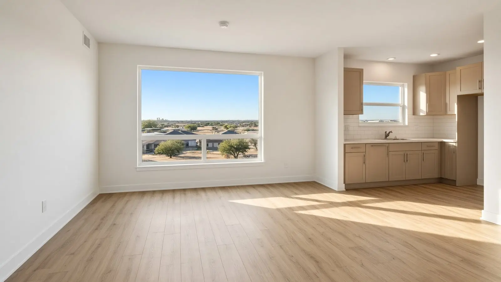 The same apartment after the turn: clean walls, clean floors, ready to lease